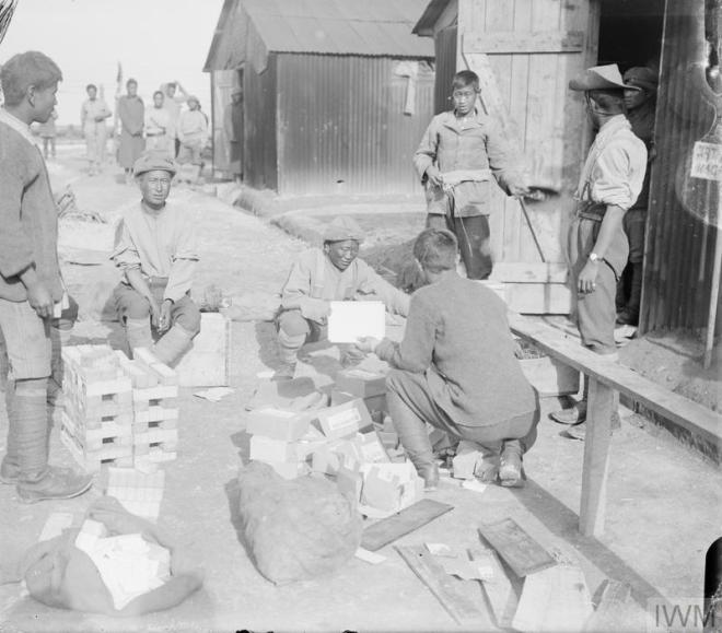Manipur Labour Corps issuing soap and cigartettes in camp at Arras Oct 1917 IWM Q 6129